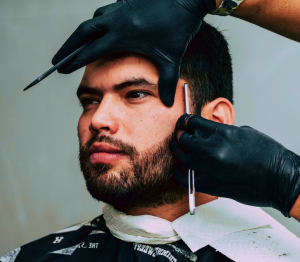 barber practicing cut throat razor 