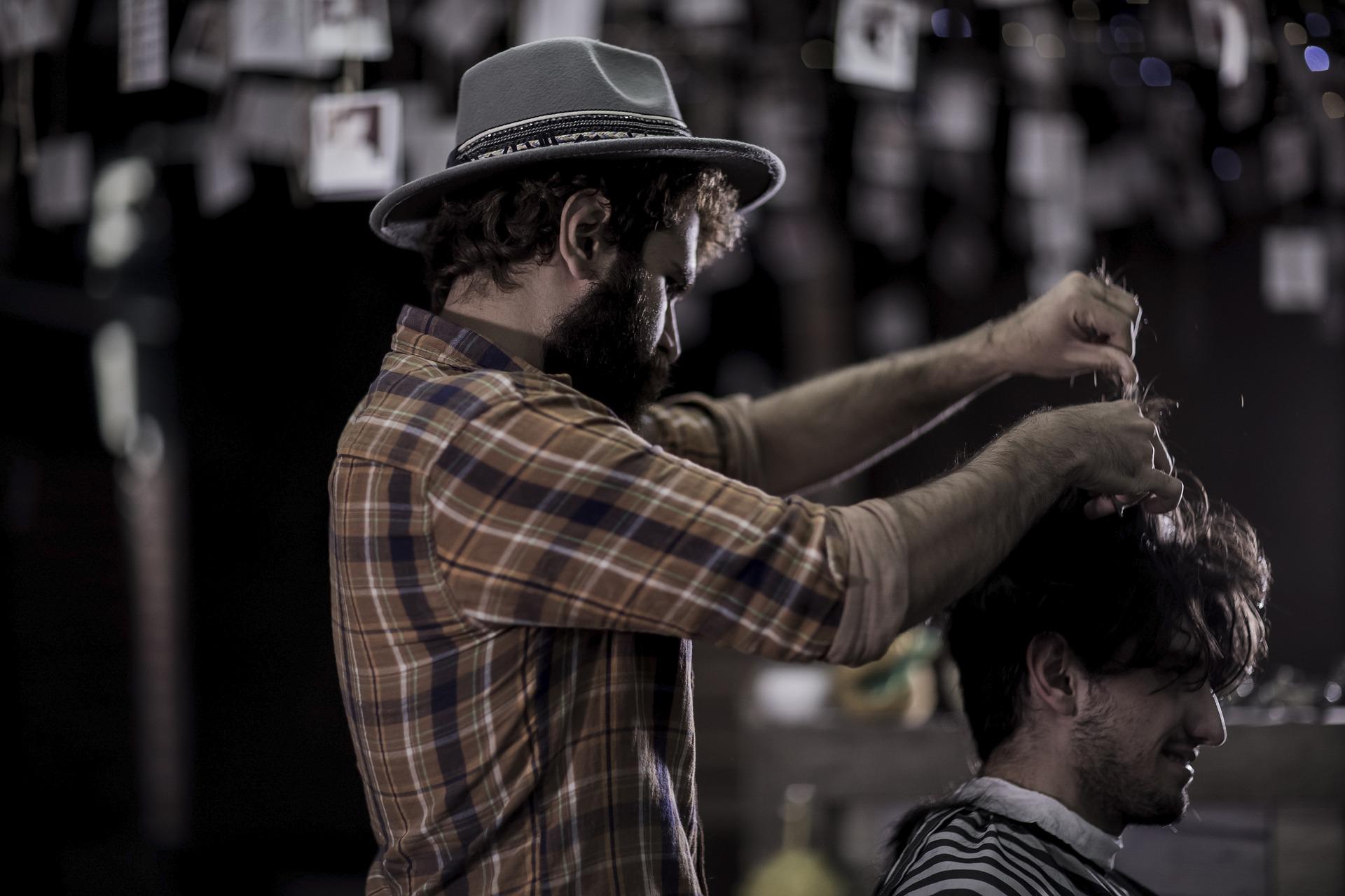 stylish barber giving a haircut