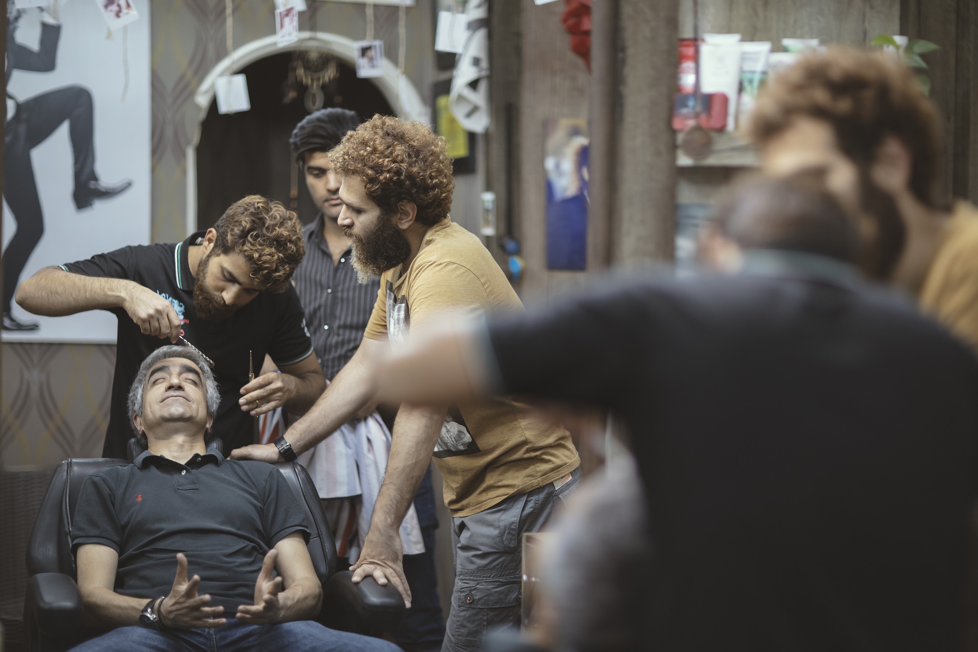 barber explaining haircutting techniques to another barber