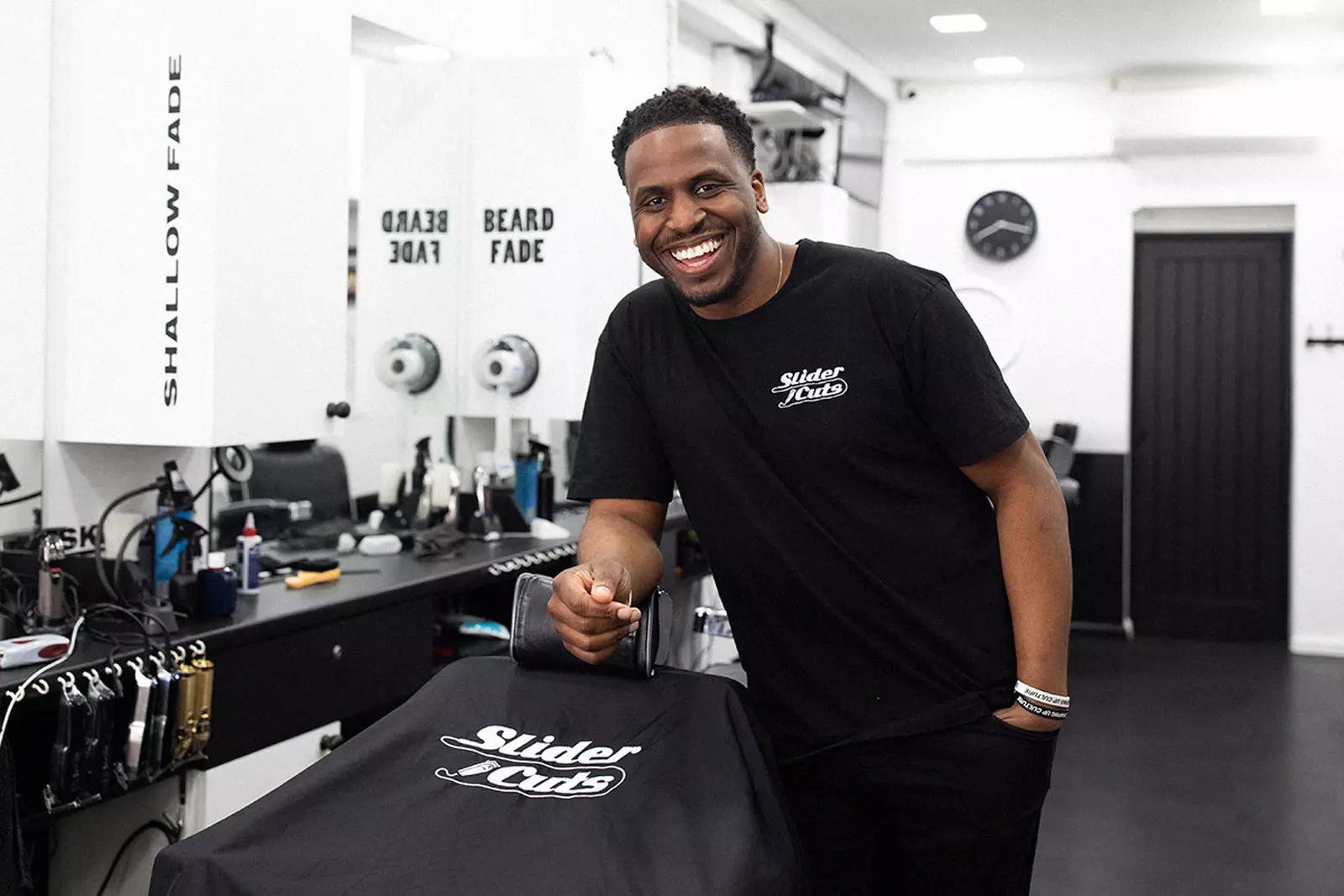 slidercuts standing in his barber shop