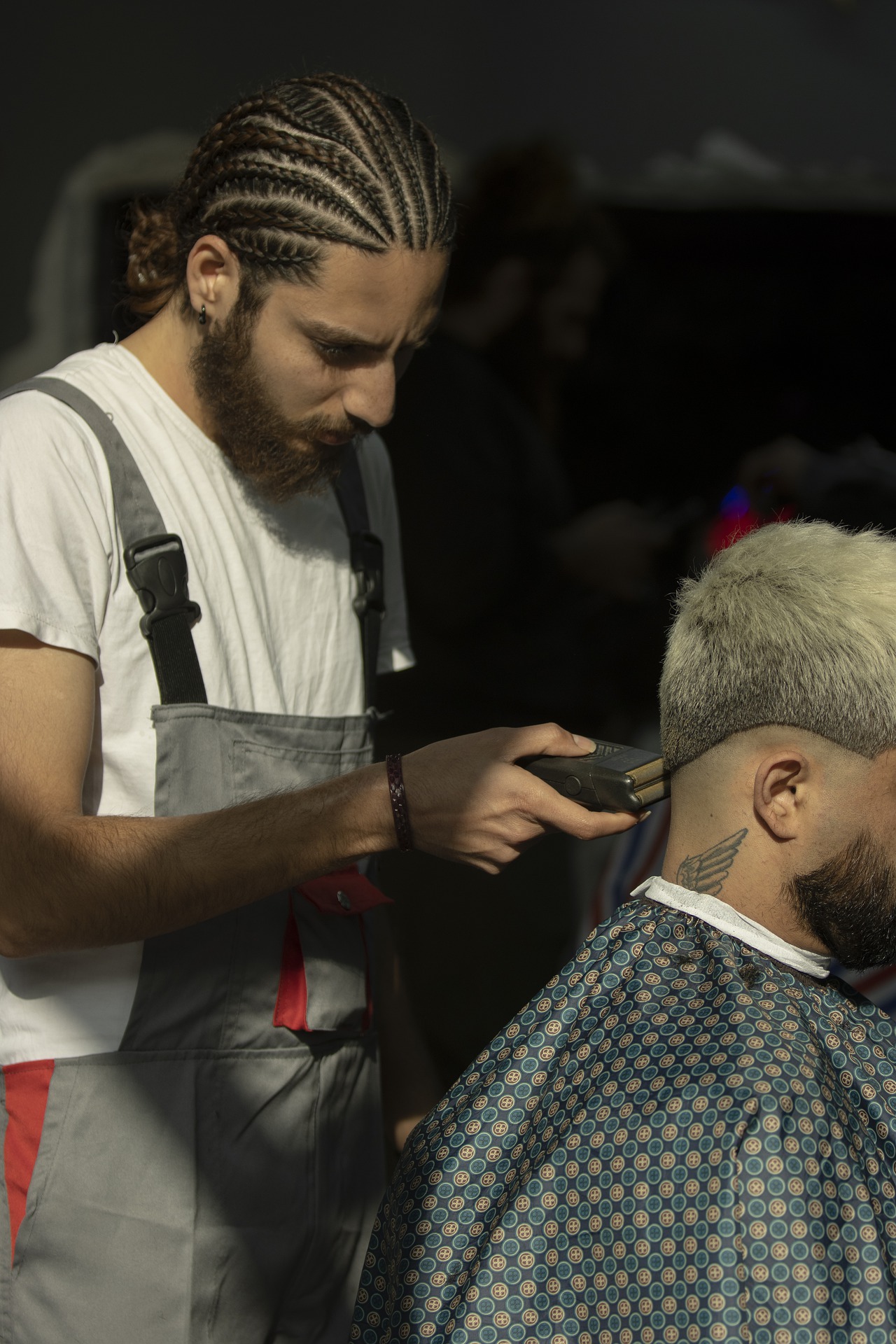 young barber cutting hair